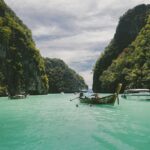 Wooden longtail boats on turquoise sea near Koh Yao Noi, Thailand