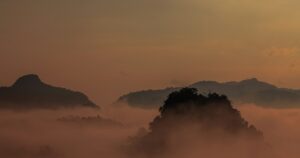 Misty mountain layers at sunrise in Northern Thailand