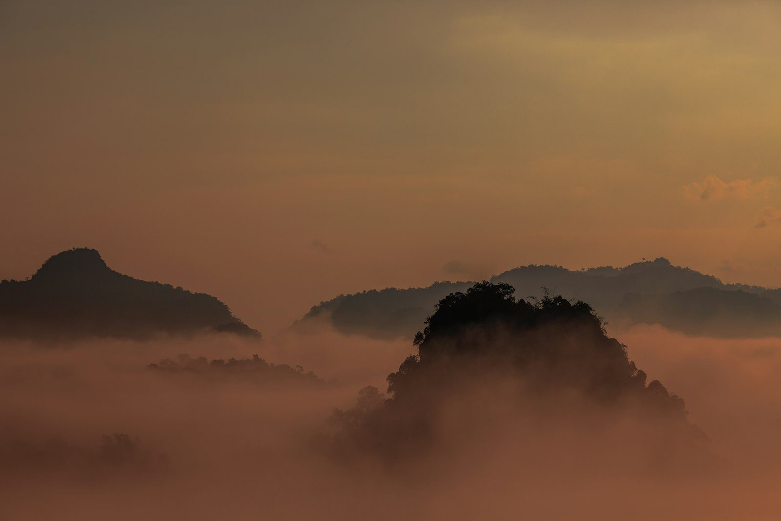 Misty mountain layers at sunrise in Northern Thailand